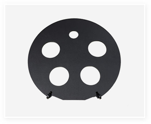 Round Metal Target Plate with Circular Cutouts Round black metal plate featuring multiple circular cutouts.