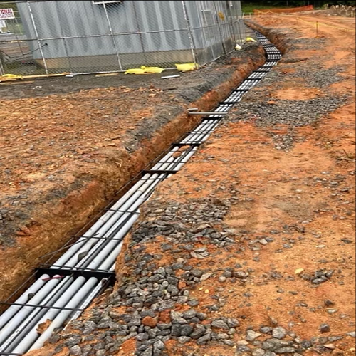 conduit piping and spacers in a trench